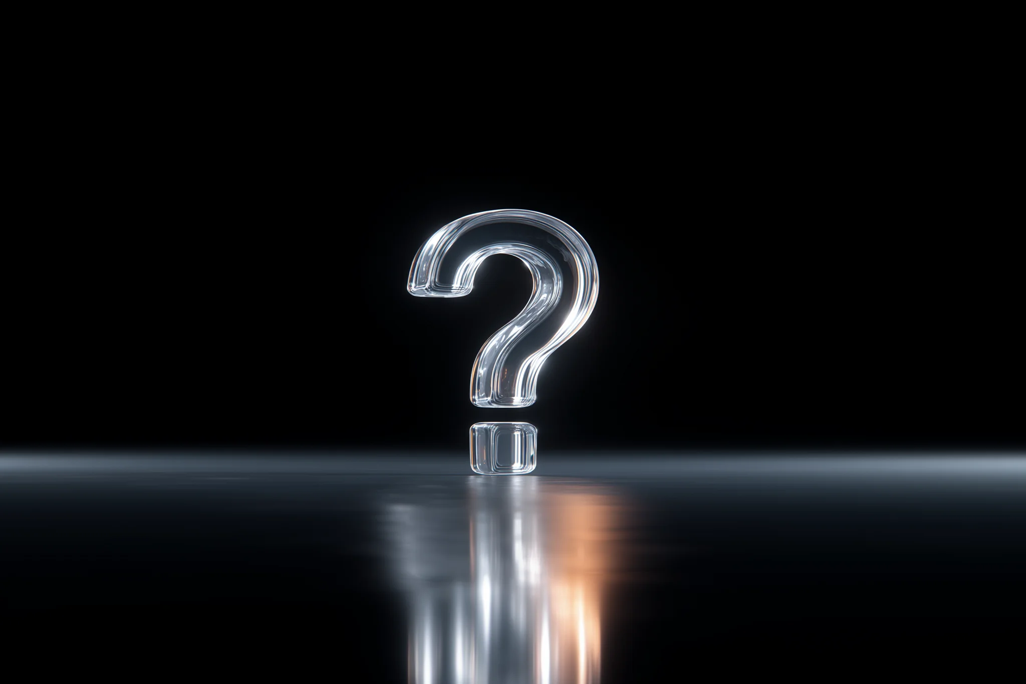 A glass question mark on a dark background.