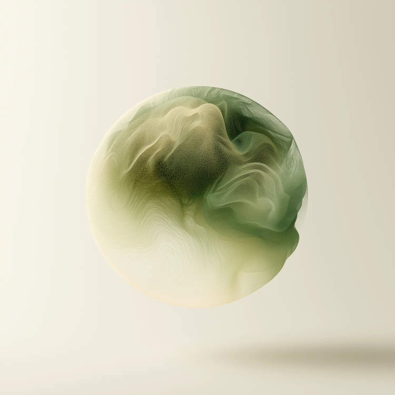 A soft green sphere floating above a cream ground