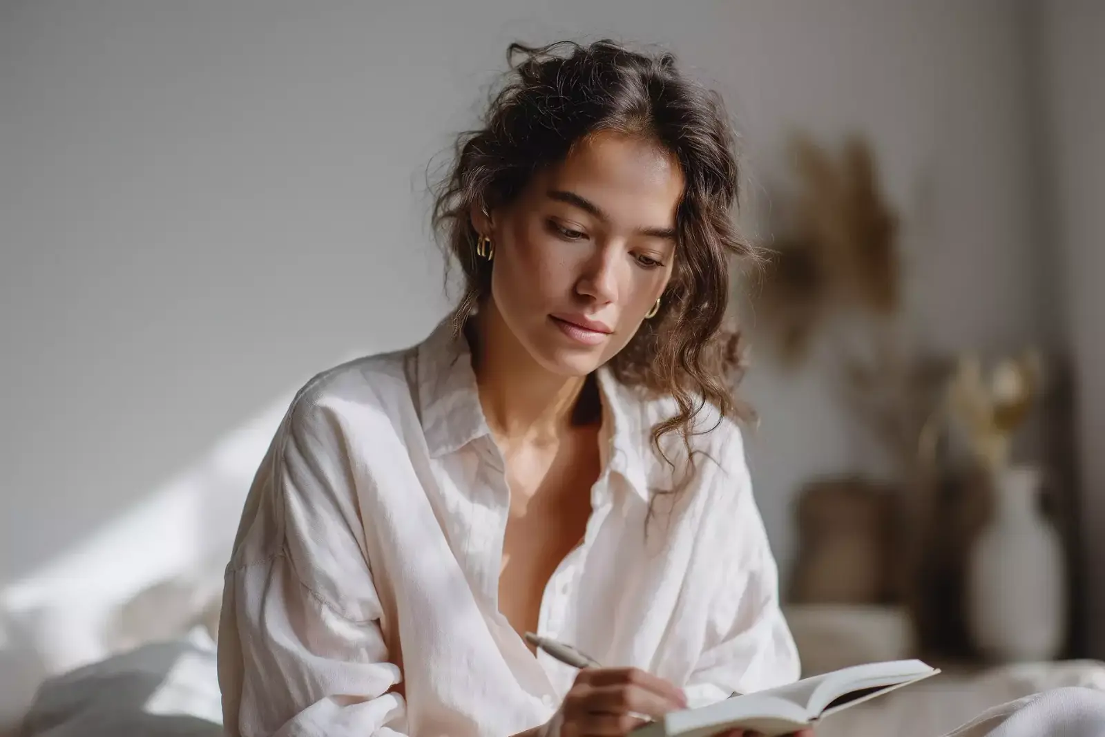 Woman planning her week in a notebook